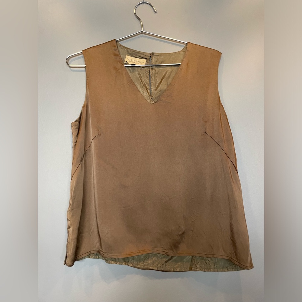 Paul Costelloe Collection top is a V-neck, sleeveless silk blouse